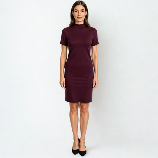 A SWABY model poses in a burgundy Modern Ribbed Knitted Dress