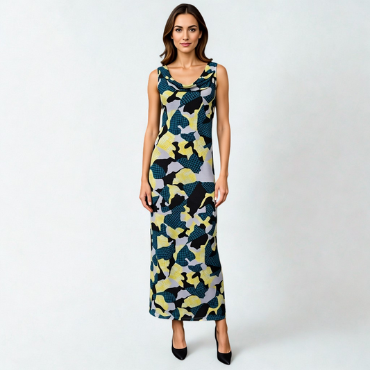 SWABY model posing in a stunning abstract maxi dress, featuring gray, black, green and yellow designs
