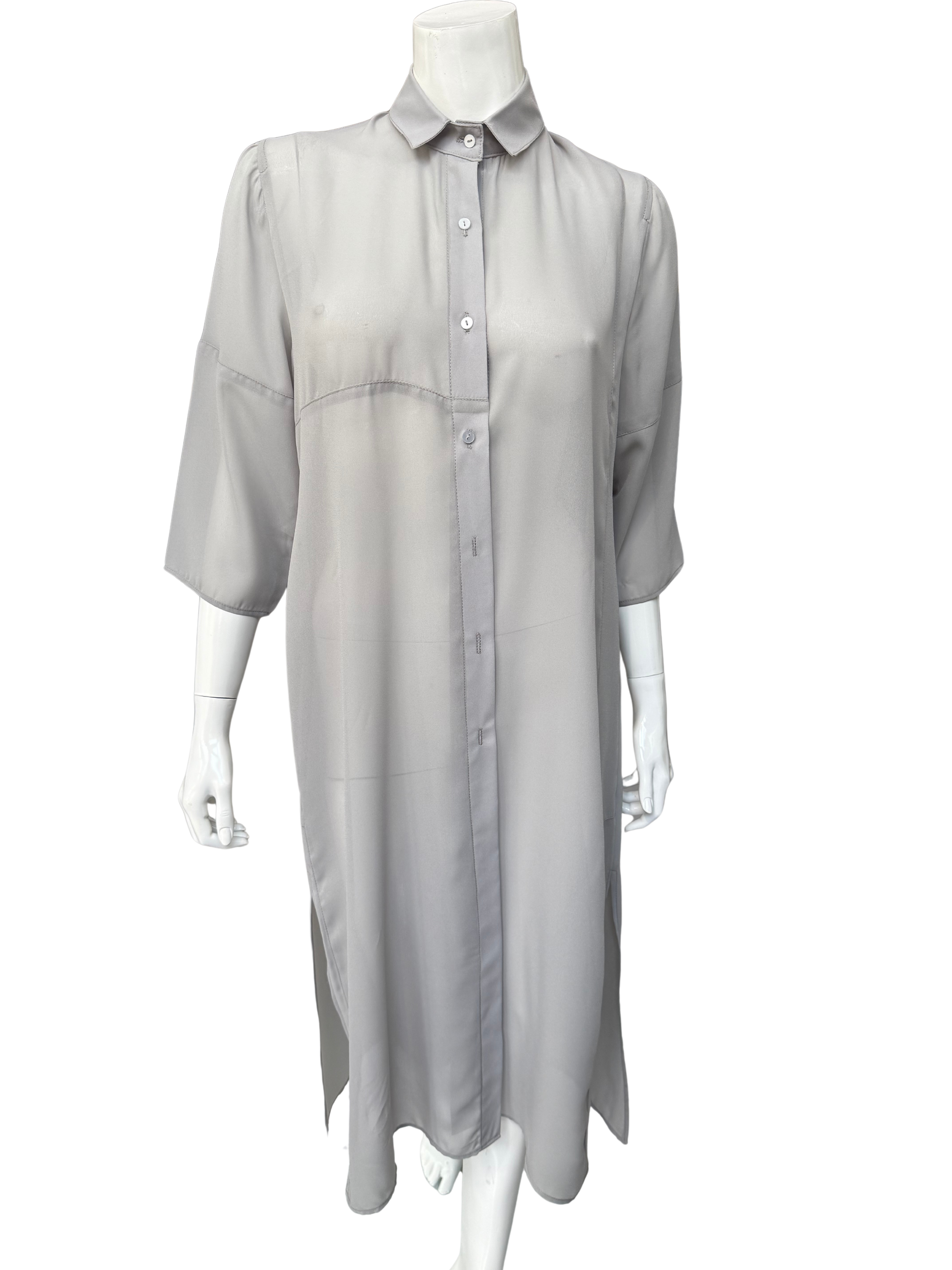 Front view of pale gray Knox Top on mannequin displaying button-front closure, polished collar, and three-quarter sleeves with refined tailoring