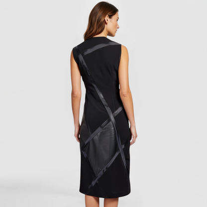 A SWABY Brixton Dress as shown on this fashion model. Asymmetrical patterns of leather straps cross the body to yield feminine strength.