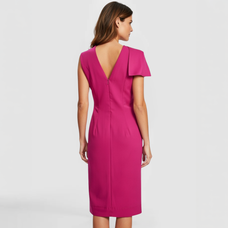 Rear view of SWABY Dylin Dress on a fashion model. Lower v-neck along the back with subtle waist.