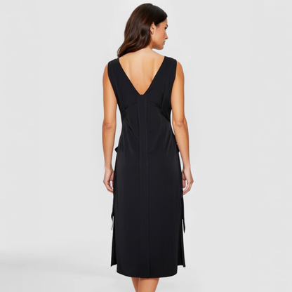 The SWABY Evie Dress shown from the rear on a fashion model. A stylish elegant dress that can be worn day or night.
