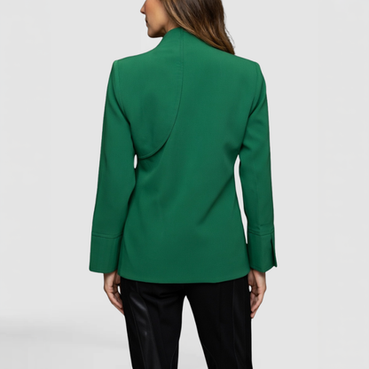 A SWABY fashion model poses to show the back of the Sadie Jacket complete with asymmetrical shoulder design. A perfect jacket for springtime.