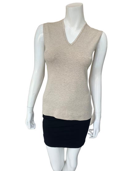 Neutral tone Shelli Top v-neck sleeveless knit top with slim fit silhouette styled with black skirt on mannequin.