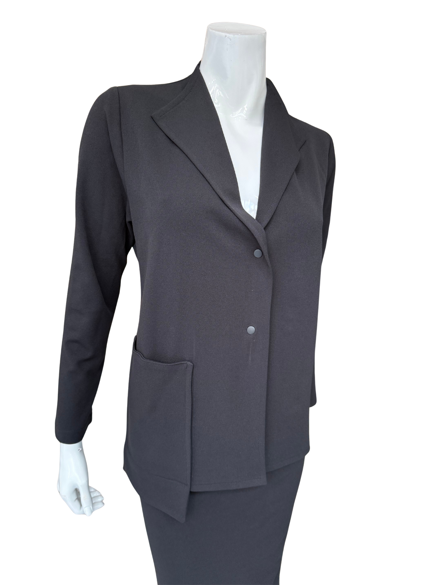 Front view of contemporary knit crepe jacket in charcoal featuring distinctive lapel design and minimalist button closure with structured silhouette