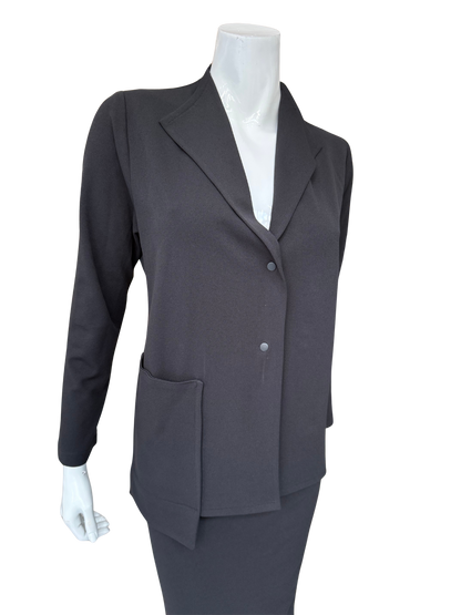 Front view of contemporary knit crepe jacket in charcoal featuring distinctive lapel design and minimalist button closure with structured silhouette